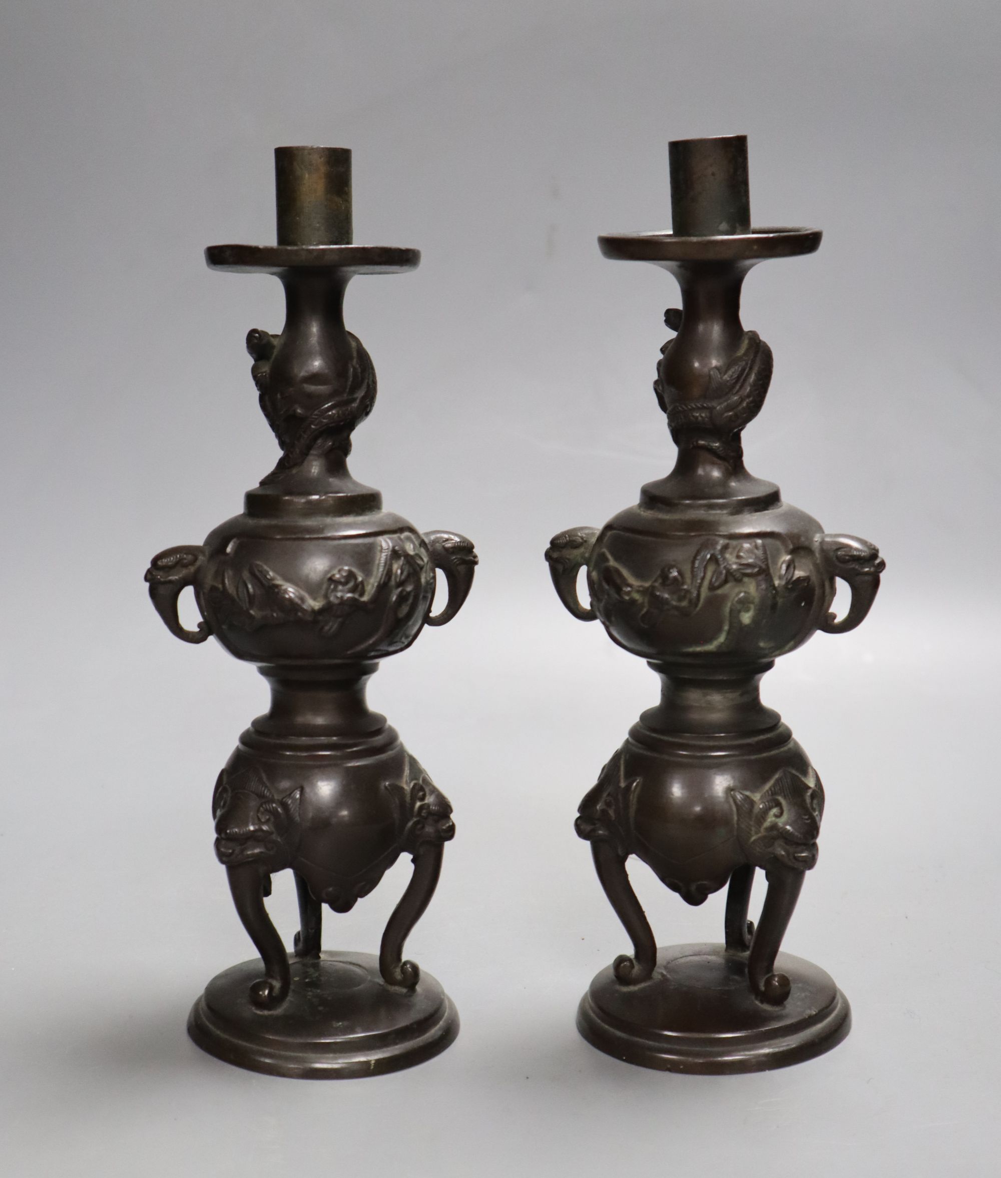 A pair of Japanese bronze candlesticks, Meiji period, height 23cm